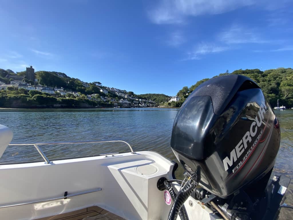 Mercury outboard motor being serviced on water