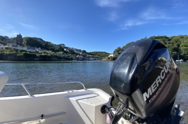 Mercury outboard motor being serviced on water