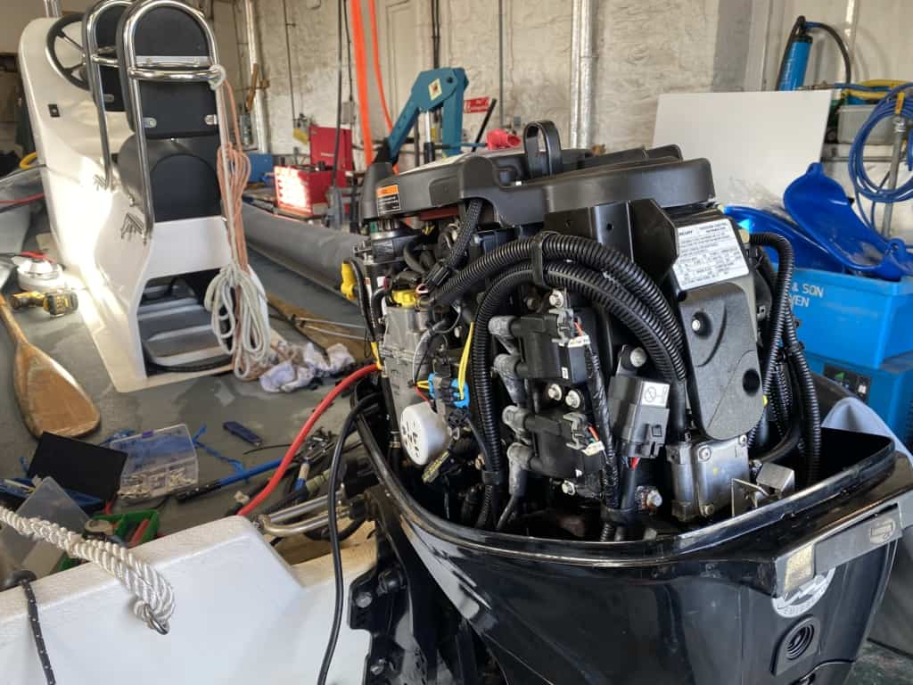 Picture of a Mercury 60 EFI outboard being repair at our workshop