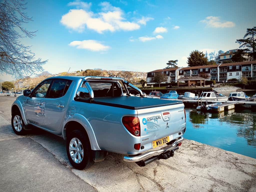 Riptide Marine's pickup truck parked at a harbour